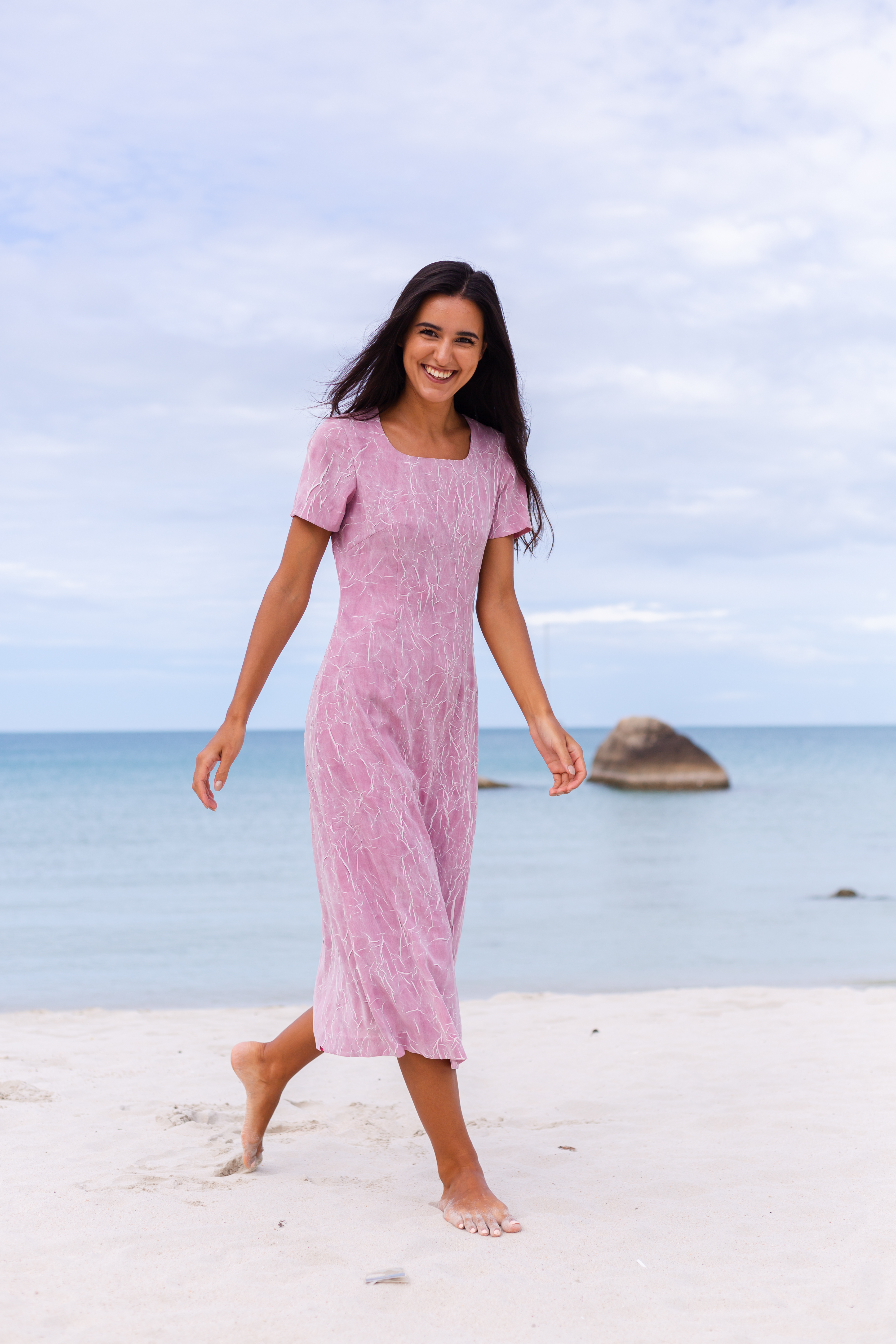 young-romantic-woman-with-long-dark-hair-dress-beach-smiling-laughing-having-nice-time-alone (1).jpg