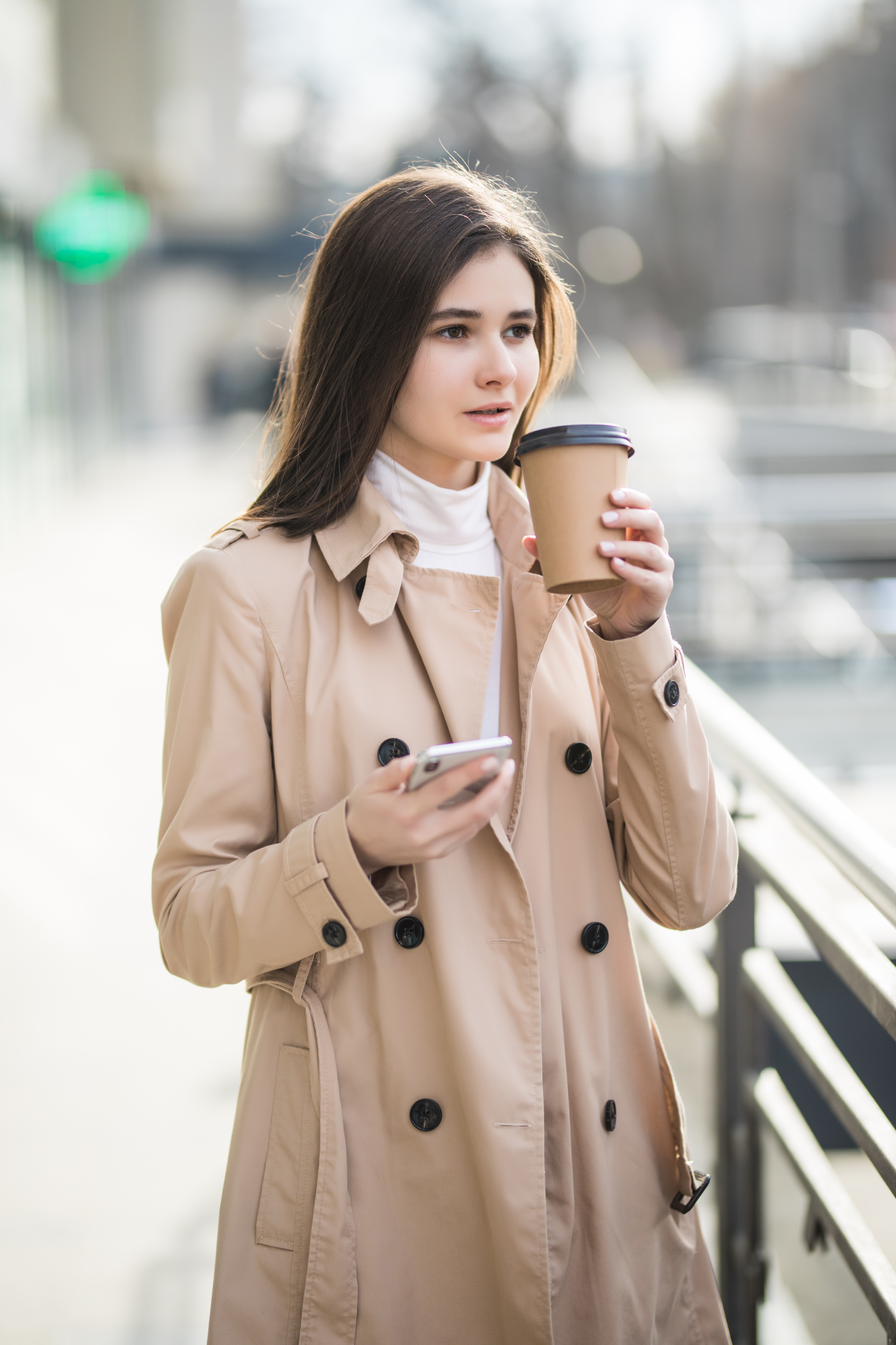 tender-young-lady-is-drinking-coffee-from-own-cup-outside.jpg