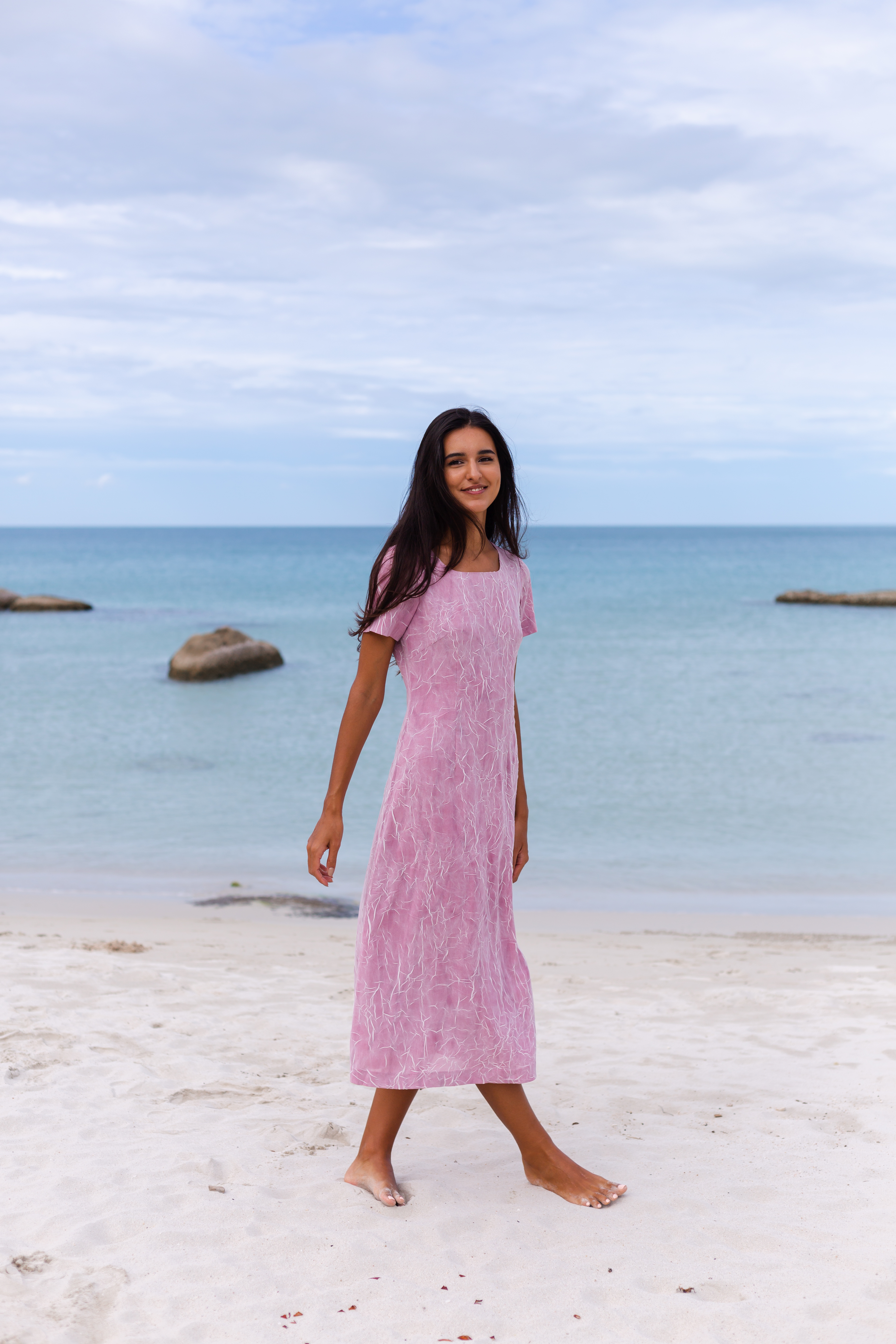 young-romantic-woman-with-long-dark-hair-dress-beach-smiling-laughing-having-nice-time-alone.jpg