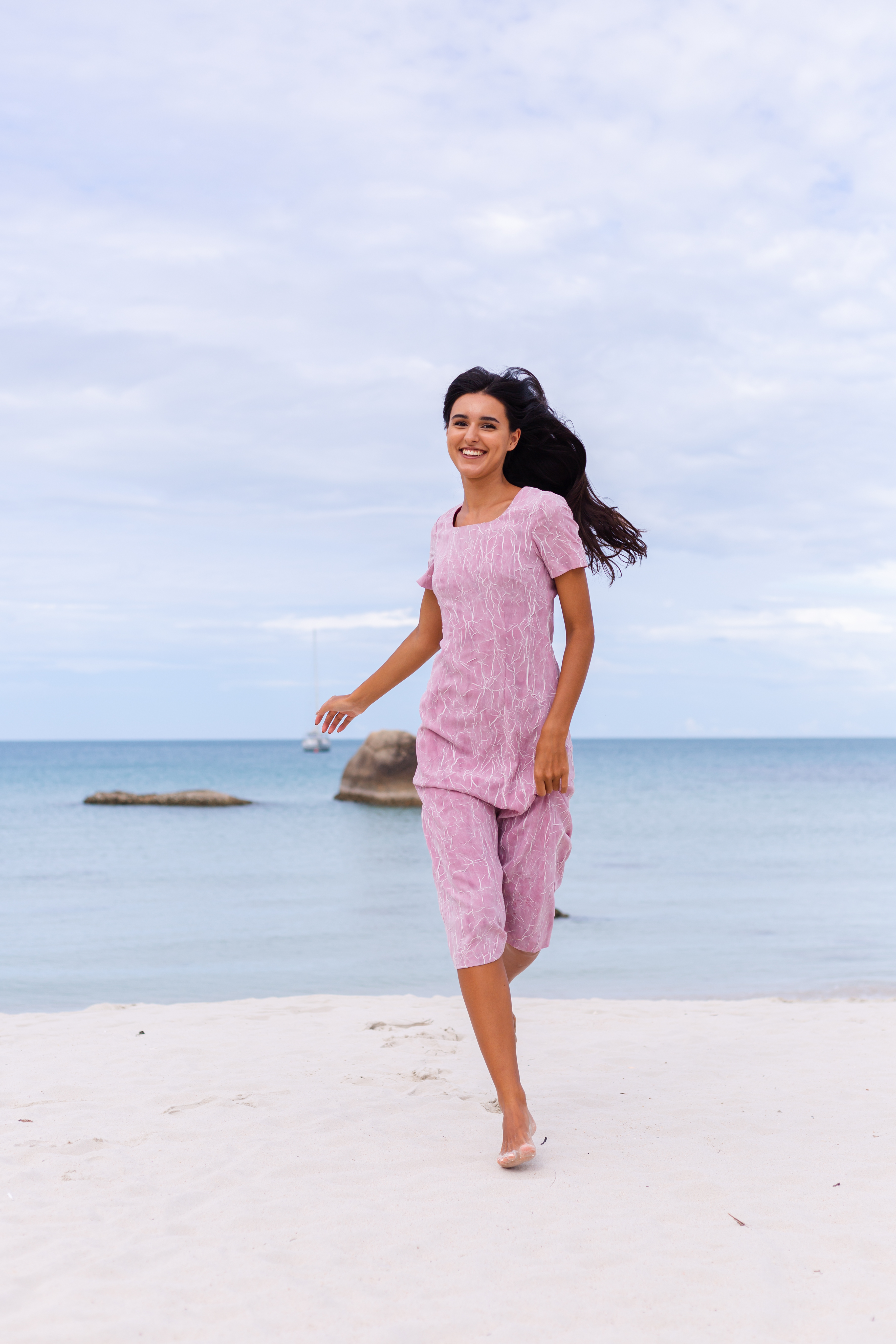 young-romantic-woman-with-long-dark-hair-dress-beach-smiling-laughing-having-nice-time-alone (2).jpg