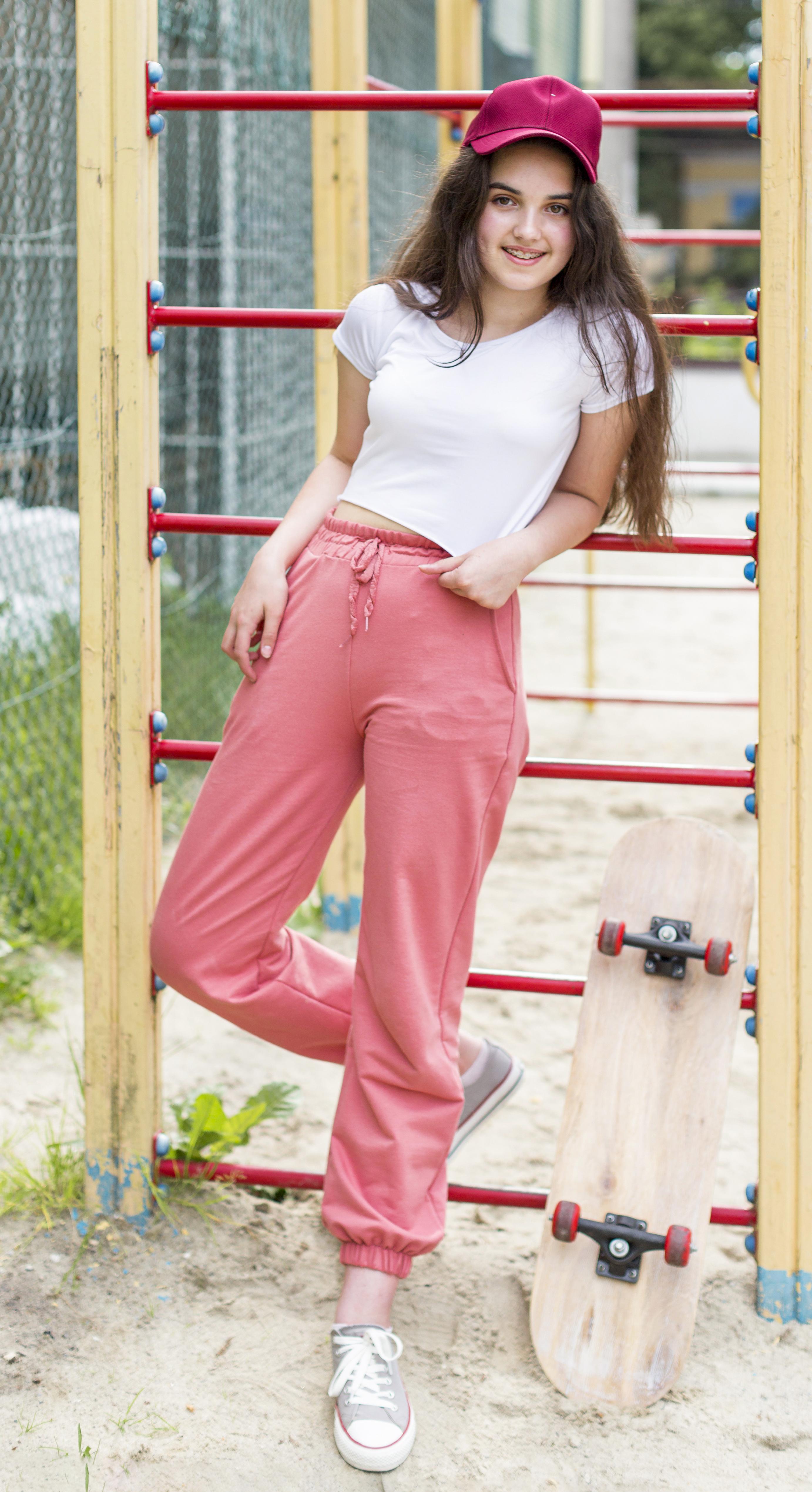 young-girl-posing-skateboard.jpg